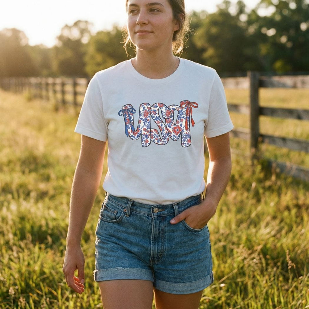 Rockledge Designs LLC Shirts & Tops Floral Coquette USA Tee – Patriotic Vintage Bow Graphic T-Shirt for 4th of July - WE503 Floral Coquette USA Tee – Patriotic Vintage Bow Graphic T-Shirt for 4th of July - WE503