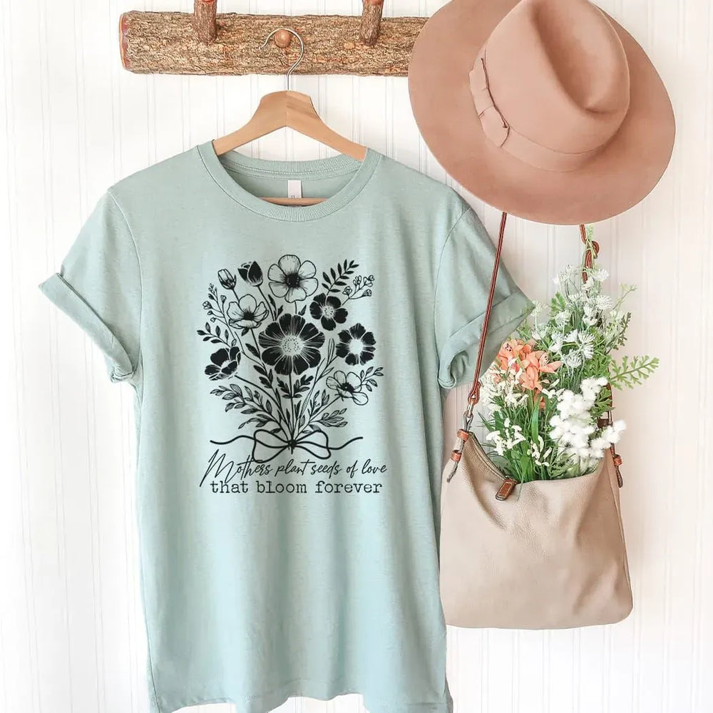 Rockledge Designs LLC Shirts & Tops Mothers Plant Seeds of Love Tee – Floral Mother’s Day Botanical Graphic T-Shirt - ML205 Mothers Plant Seeds of Love Tee – Floral Mother’s Day Botanical Graphic T-Shirt - ML205
