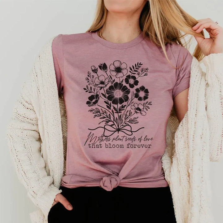 Rockledge Designs LLC Shirts & Tops Mothers Plant Seeds of Love Tee – Floral Mother’s Day Botanical Graphic T-Shirt - ML205 Mothers Plant Seeds of Love Tee – Floral Mother’s Day Botanical Graphic T-Shirt - ML205