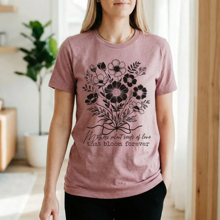 Rockledge Designs LLC Shirts & Tops Mothers Plant Seeds of Love Tee – Floral Mother’s Day Botanical Graphic T-Shirt - ML205 Mothers Plant Seeds of Love Tee – Floral Mother’s Day Botanical Graphic T-Shirt - ML205
