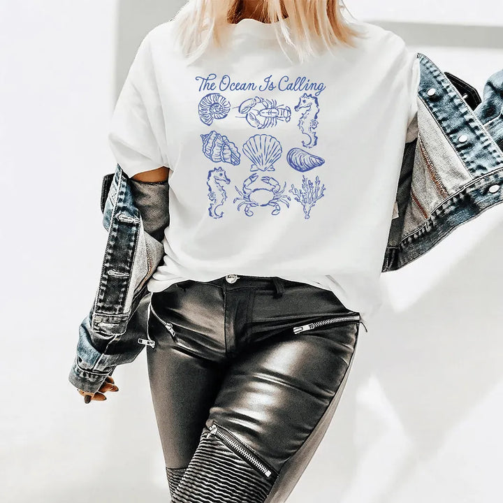 Rockledge Designs LLC Shirts & Tops The Ocean Is Calling Graphic Tee – Coastal Seashell Shirt – Beach Lover Nautical T-Shirt - SE119 The Ocean Is Calling Graphic Tee – Coastal Seashell Shirt – Beach Lover Nautical T-Shirt - SE119